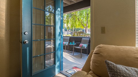 Estancia living rooms with glass doors and private balconies